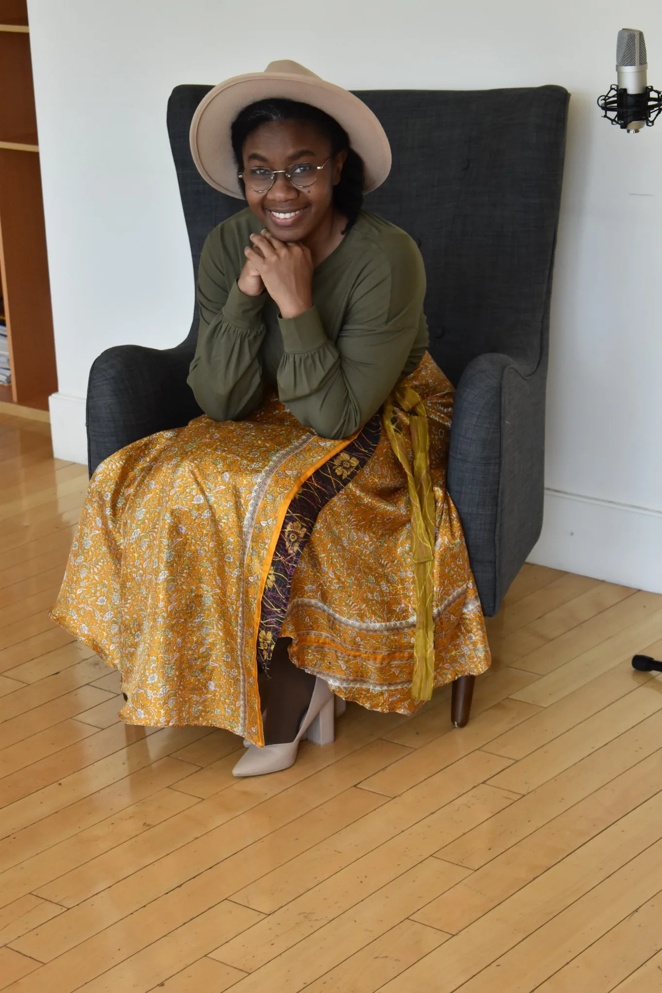 Portrait of EsterWill seated and smiling